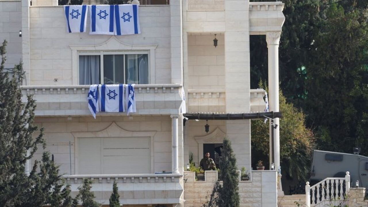 Palestinian homes marked with an "X" by the Israeli army after evacuation are seen in Hebron