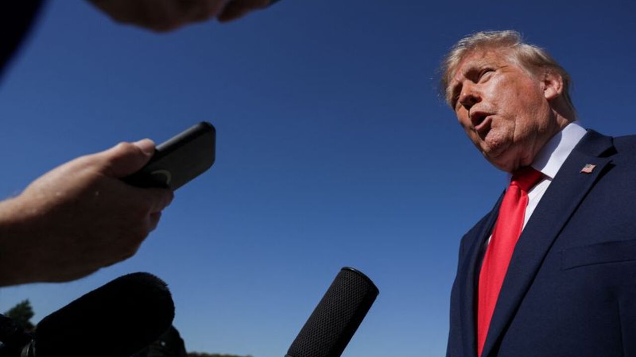 US President Donald Trump boards Air Force One en route to Michigan