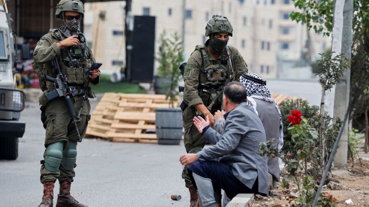 Palestinian residents protest against their displacement from a neighbourhood, amid ongoing Israeli military operations, in Hebron