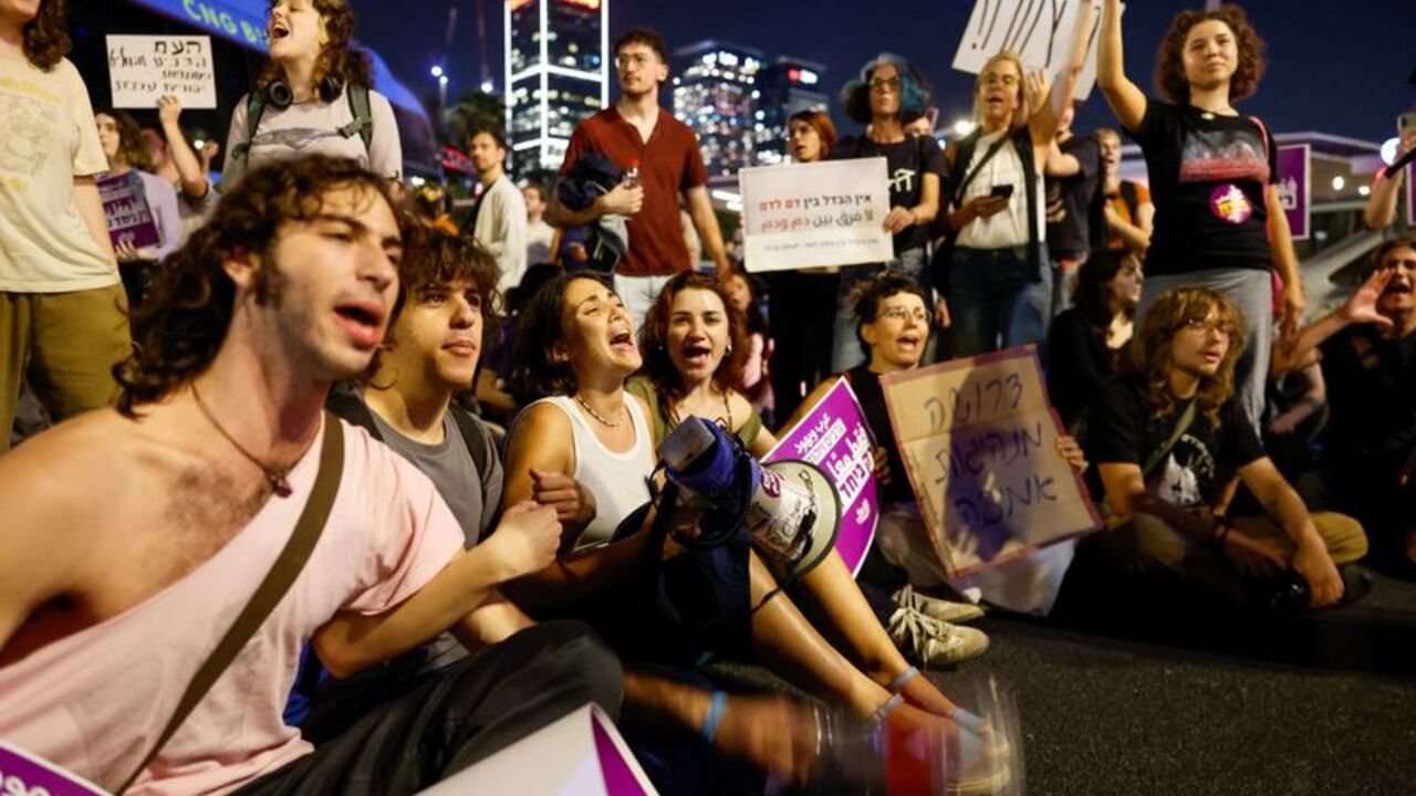Protesters take part in a rally demanding that Israel-Arab parties in Israel be included in the formation of the next government coalition, in Tel Aviv