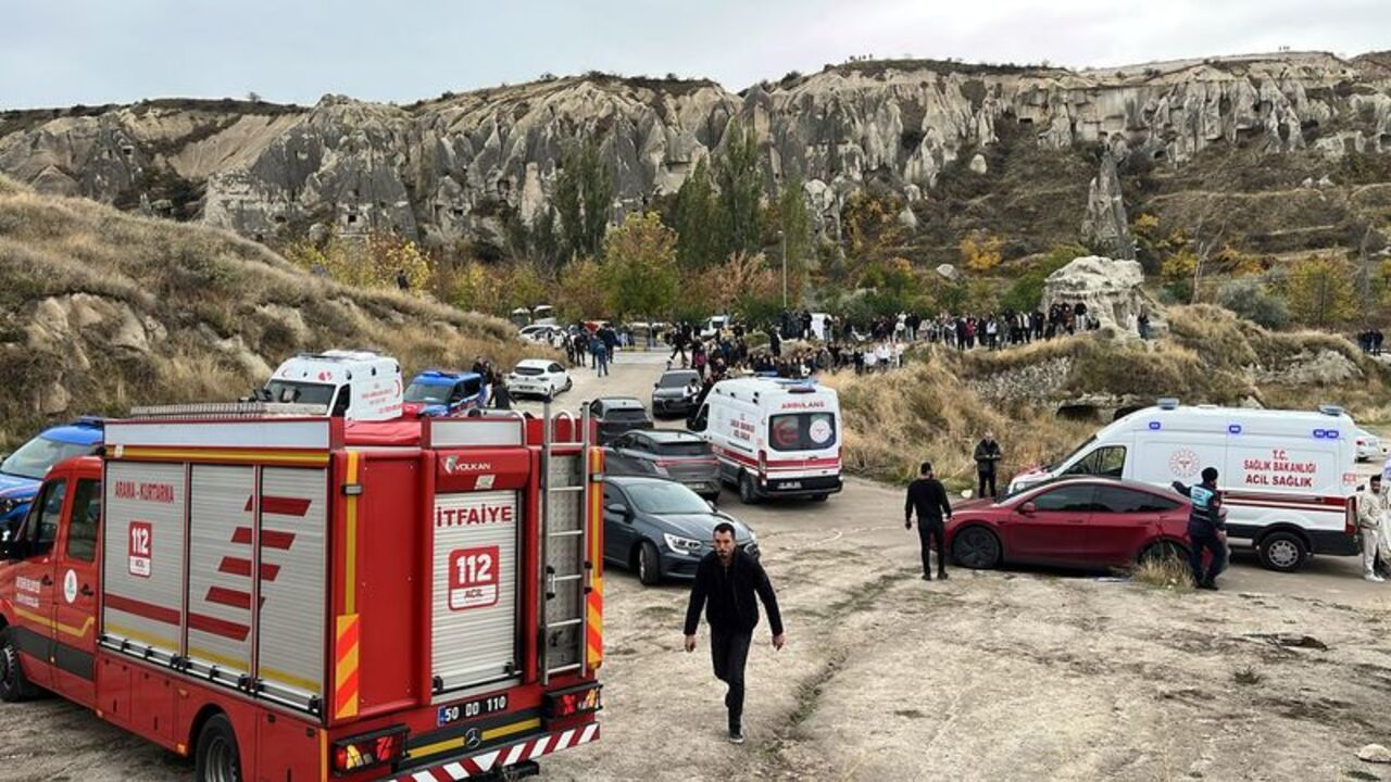 A fire truck and ambulances are parked near the scene after rocks fell from a fairy chimney in Cappadocia region