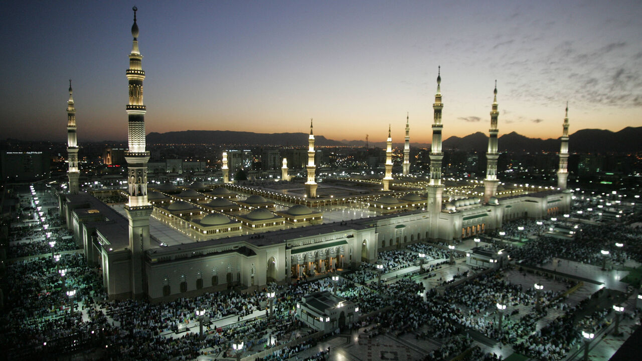 The Prophet Mohammed Mosque is lit during the sunset prayers in the holy Saudi city of Medina 11 January 2005. Saudi Arabia began receiving Muslim pilgrims early this month in preparation for the annual hajj (pilgrimage), scheduled to take place in the last two weeks of January. Islam's Prophet Mohammed is buried in Medina's landmark mosque, which is Islam's second holiest shrine. All Muslims are required to make the pilgrimage to the Muslim holy city of Mecca, one of the five pillars of Islam, at least onc