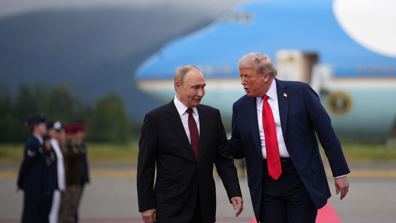 ANCHORAGE, ALASKA - AUGUST 15: U.S. President Donald Trump (R) walks with Russian President Vladimir Putin as they arrives at Joint Base Elmendorf-Richardson on August 15, 2025 in Anchorage, Alaska. The two leaders are meeting for peace talks aimed at ending the war in Ukraine. (Photo by Andrew Harnik/Getty Images)