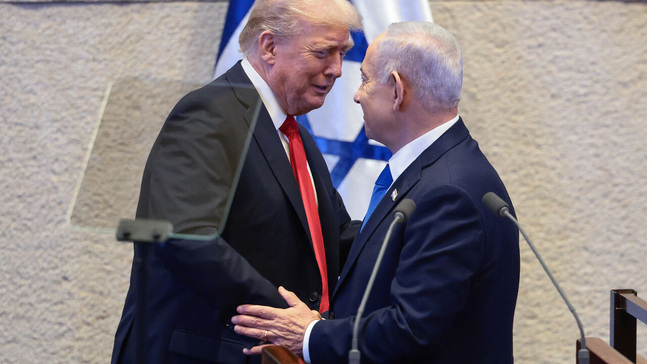 JERUSALEM - OCTOBER 13: U.S. President Donald Trump shakes hands and speaks with Israeli Prime Minister Benjamin Netanyahu at the Knesset, Israel's parliament, on the day of Trump's address on October 13, 2025 in Jerusalem. President Trump is visiting the country hours after Hamas released the remaining Israeli hostages captured on Oct. 7, 2023, part of a US-brokered ceasefire deal to end the war in Gaza. (Photo by Evelyn Hockstein - Pool/Getty Images)
