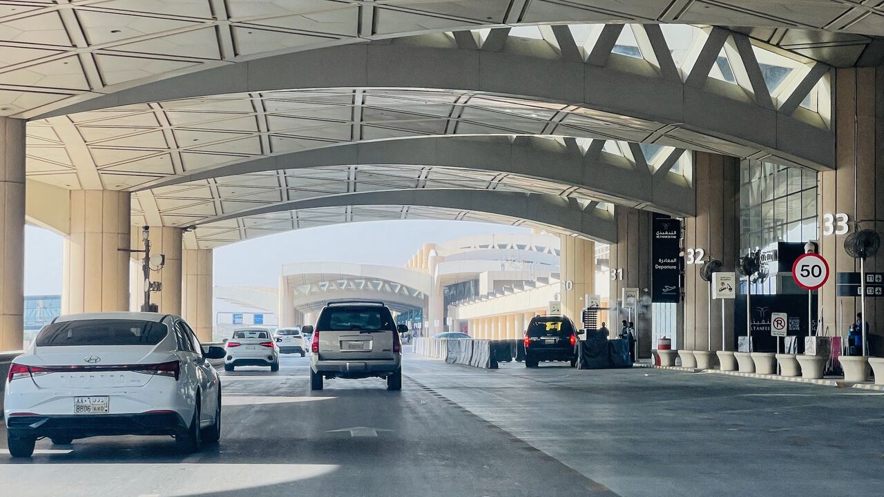 Cars drive past the gates of King Khalid International Airport in Riyadh on Sept. 19, 2026. 