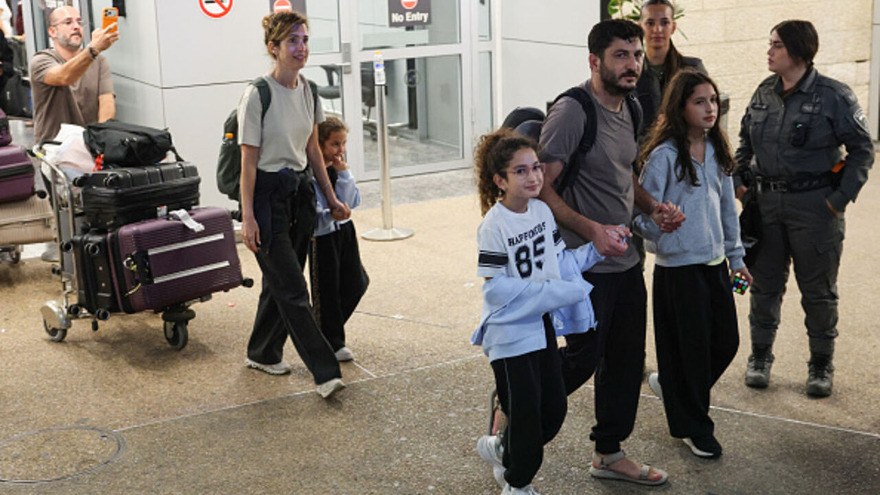 Passengers from an earlier diverted flydubai flight are seen after landing at Israel's Ben Gurion Airport in Lod on September 30, 2026. The flight, also operated by flydubai, landed on the tarmac of Ben Gurion airport at 1534 GMT, after the passengers' earlier flight was diverted to Saudi Arabia due to an altercation between the pilots. Israeli Prime Minister Benjamin Netanyahu said on September 30 that the pilot of a Tel Aviv-bound flydubai flight had tried to crash the plane and kill its passengers, after