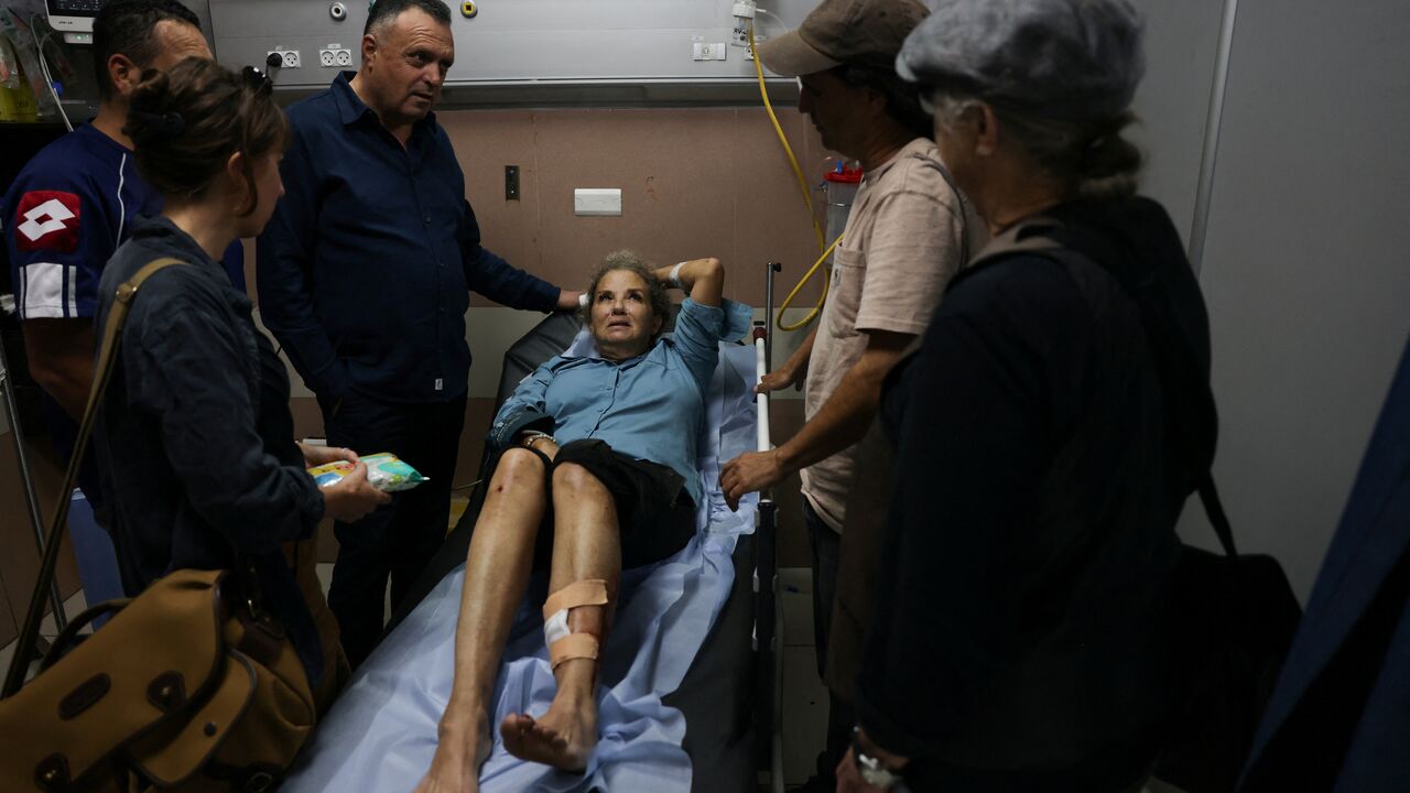 American freelance photojournalist Heidi Levine lies on a gurney in the emergency room of the government hospital in the Israeli-occupied city of Ramallah, as she is treated after being attacked by Israeli settlers while photographing Palestinian farmers harvesting their olives, in the Palestinian village of Abu Falah on Oct. 16, 2026.