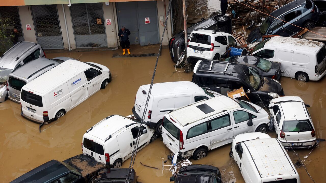 Abandoned cars piled up among debris and standing water following extremely heavy rainfall, Istanbul, Turkey, Oct. 15, 2026. 