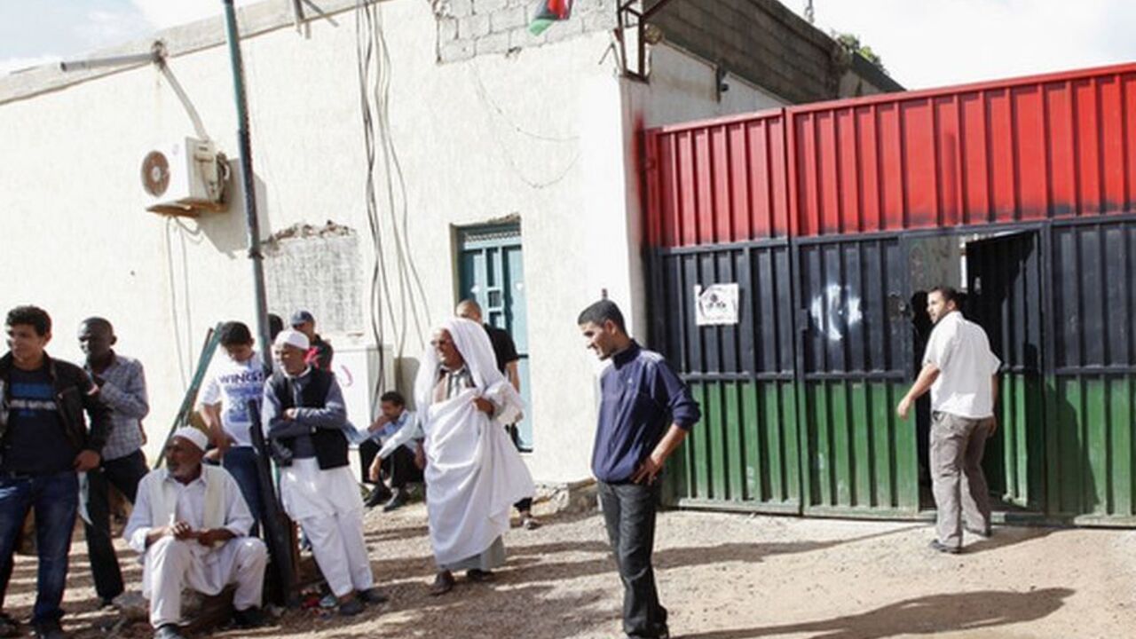 Families of imprisoned Gaddafi loyalists gather outside a prison in the Tajura area of Tripoli November 3, 2011. The families are calling for the release of their family members. REUTERS/Ismail Zitouny (LIBYA - Tags: POLITICS CRIME LAW SOCIETY)