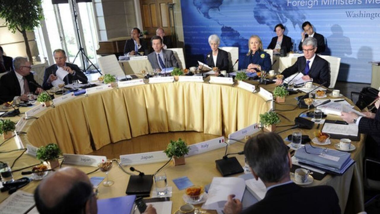 U.S. Secretary of State Hillary Clinton (back C) makes opening remarks at the Plenary Session of the G-8 Foreign Ministers Meeting at Blair House in Washington April 11, 2012. The attendees are expected to discuss Middle East peace, North Korea's plans to launch a rocket and Iran's nuclear program.   REUTERS/Mike Theiler   (UNITED STATES - Tags: POLITICS)