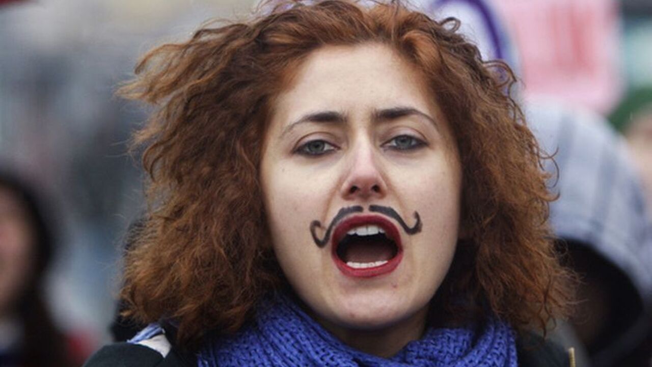 A woman shouts slogans during a demonstration to mark the International Women's Day in the Asian side of Istanbul March 6, 2010. REUTERS/Osman Orsal (TURKEY - Tags: POLITICS CIVIL UNREST SOCIETY)