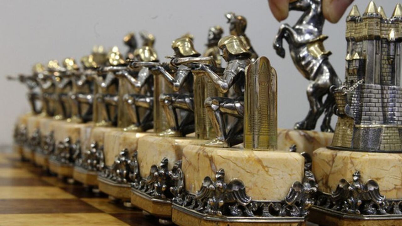 "Chess of the Middle Ages" exhibit, made of gold, silver and other jewelry, is displayed during the "Junwex. Petersburg" jewelry exhibition in St. Petersburg, February 1, 2012. The exhibition presented the works of Russian and foreign jewellery producers. The exhibit costs about $50,000. REUTERS/Alexander Demianchuk  (RUSSIA - Tags: SOCIETY)