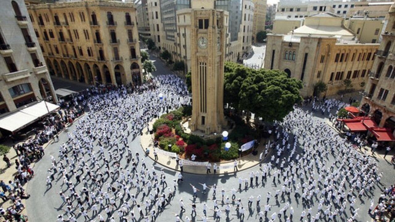 Lebanese students dance during "The Big Dance" event in downtown Beirut, near the parliament May 18, 2012. "The Big Dance" is an initiative of the British Council's global project "Connecting Classrooms" which aims to develop links between schools in Britain and Lebanon. REUTERS/Sharif Karim   (LEBANON - Tags: SOCIETY EDUCATION)
