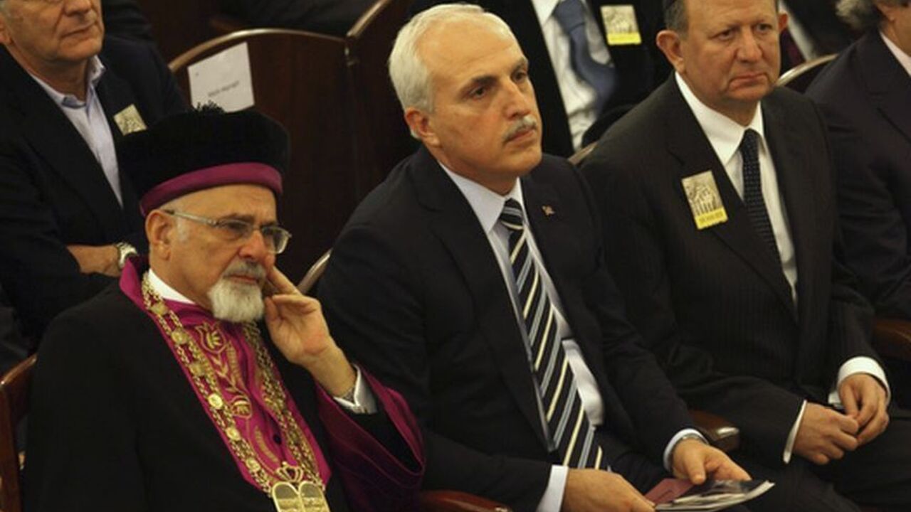Istanbul's Governor Huseyin Avni Mutlu (2nd L), Turkey's Chief Rabbi Izak Haleva (L) and Turkish Jewish community leader Sami Herman (2nd R) attend a commemoration to mark International Holocaust Remembrance Day at Neve Shalom Synagogue in Istanbul January 26, 2012. The event occurs a day ahead of the annual International Day of Commemoration, which was designated by the United Nations General Assembly to honour Holocaust victims. REUTERS/Murad Sezer (TURKEY - Tags: POLITICS RELIGION ANNIVERSARY)