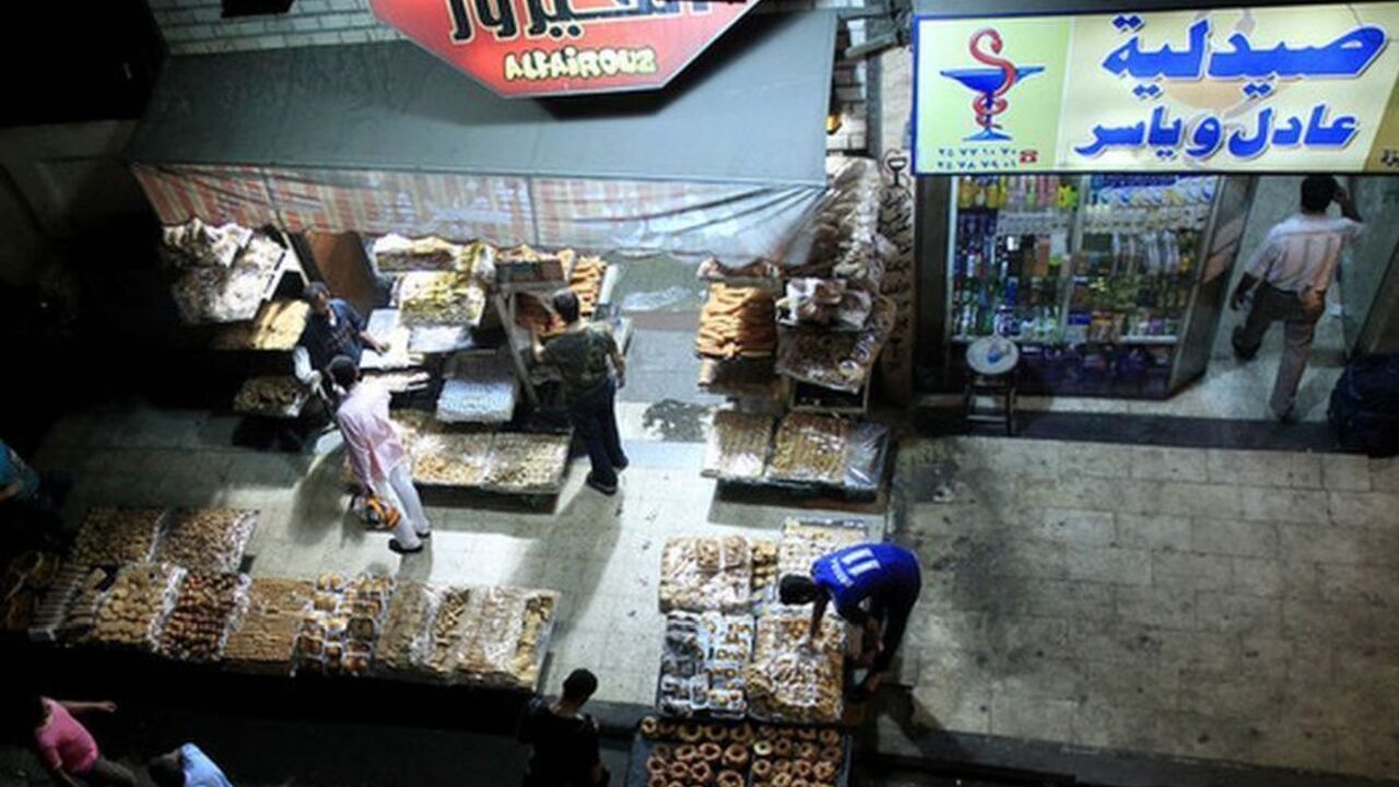Shops are seen open after 10 p.m. , along a street in Cairo October 22, 2012. A new government desperate to break with the administrative chaos that followed Hosni Mubarak's overthrow says it will enforce a ban on late-night shopping next week and restore order to streets that have come to resemble vast open-air bazaars. Picture taken October 22, 2012. To match Feature EGYPT-SHOPPING/NIGHT REUTERS/Mohamed Abd El Ghany (EGYPT - Tags: BUSINESS)