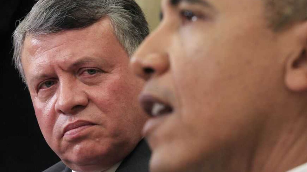 Jordan's King Abdullah (L) listens next to U.S. President Barack Obama in the Oval Office of the White House in Washington January 17, 2012. The two leaders met to discuss advancing peace talks between Israel and the Palestinians.  REUTERS/Kevin Lamarque (UNITED STATES - Tags: POLITICS ROYALS)