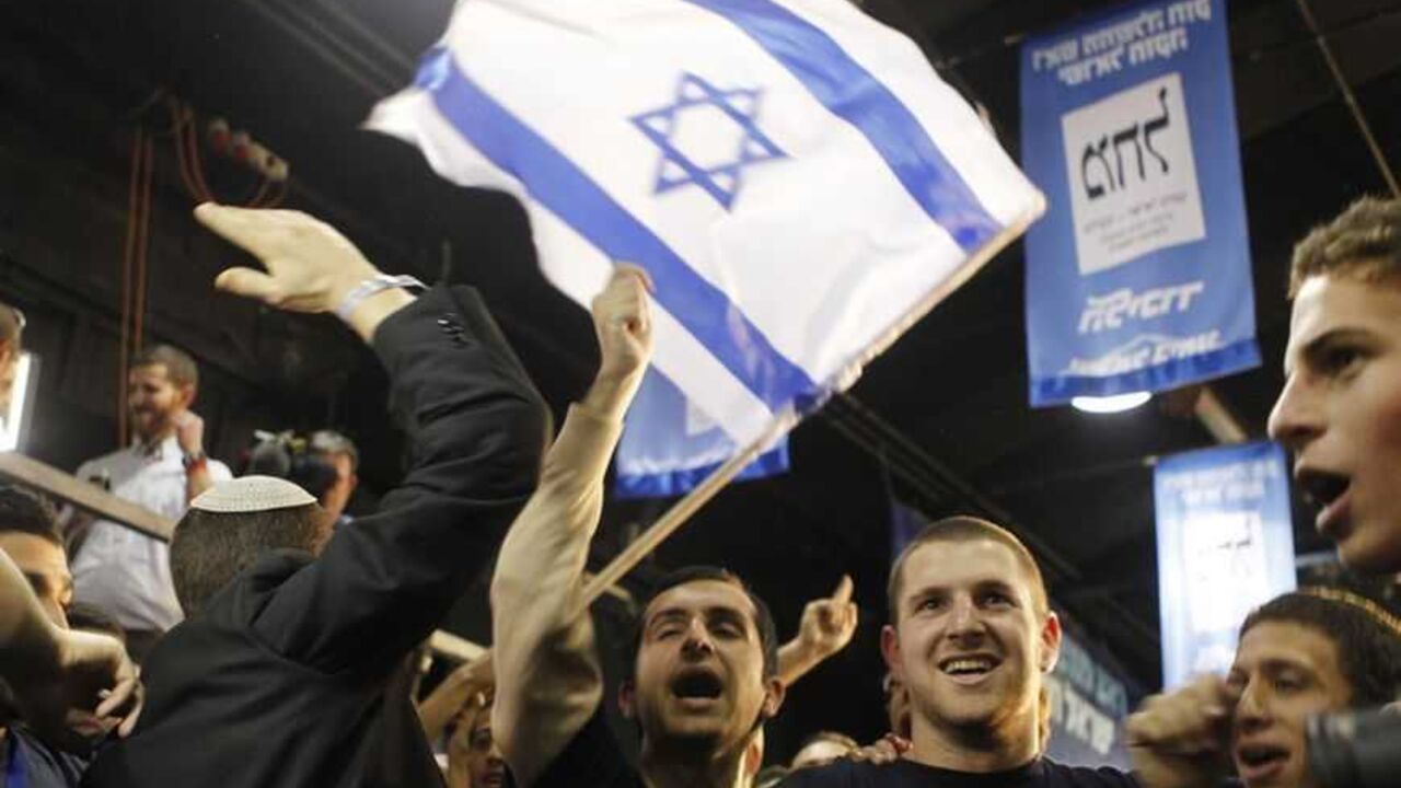 Supporters of Prime Minister Benjamin Netanyahu's Likud party celebrate after the exit polls were announced at the party's headquarters in Tel Aviv January 22, 2013. Hawkish Prime Minister Benjamin Netanyahu emerged the bruised winner of Israel's election on Tuesday, claiming victory despite unexpected losses to resurgent centre-left challengers. REUTERS/Nir Elias (ISRAEL - Tags: POLITICS ELECTIONS)