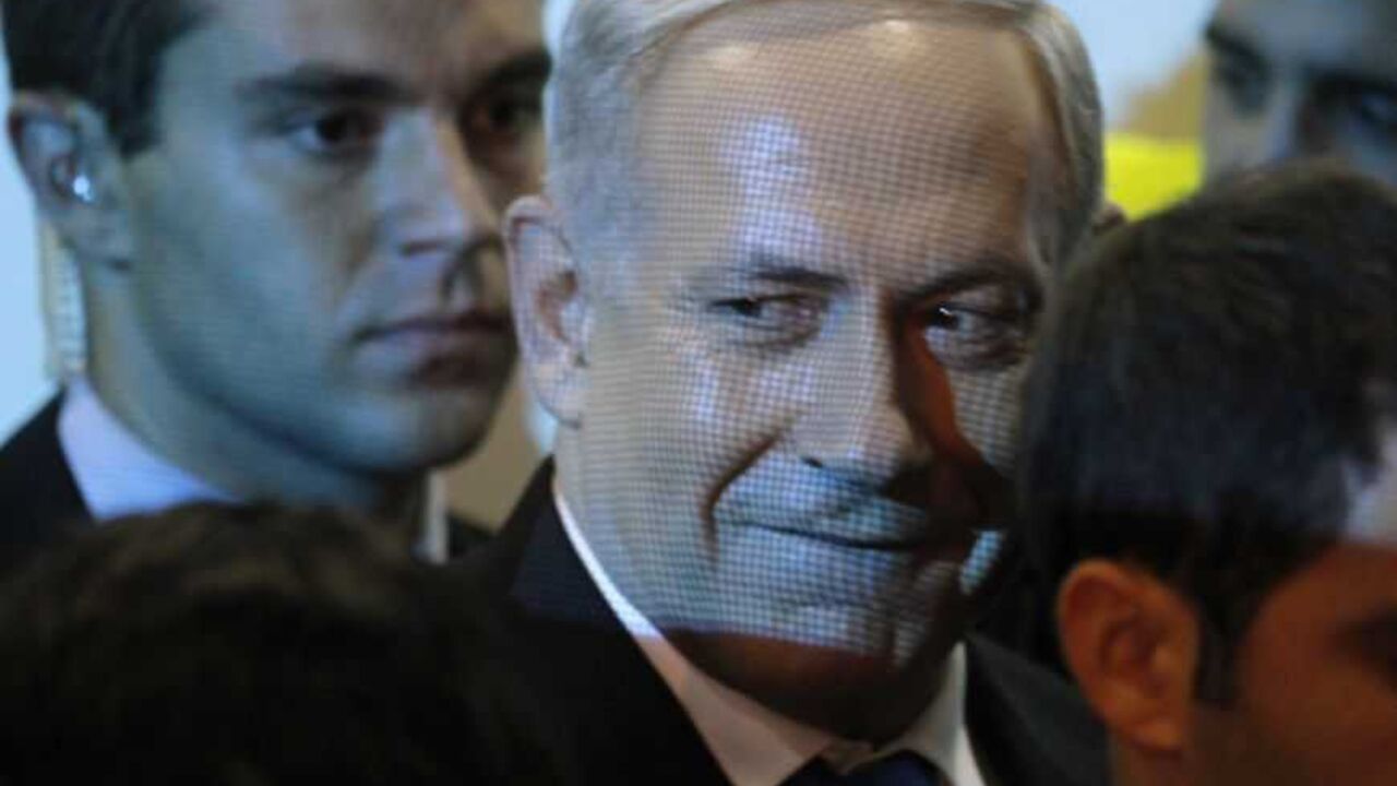 Israel's Prime Minister Benjamin Netanyahu (C) leaves the Likud-Yisrael Beitenu headquarters in Tel Aviv January 23, 2013. Hawkish Prime Minister Netanyahu emerged the bruised winner of Israel's election on Tuesday, claiming victory despite unexpected losses to resurgent centre-left challengers. REUTERS/Nir Elias (ISRAEL - Tags: POLITICS ELECTIONS TPX IMAGES OF THE DAY)