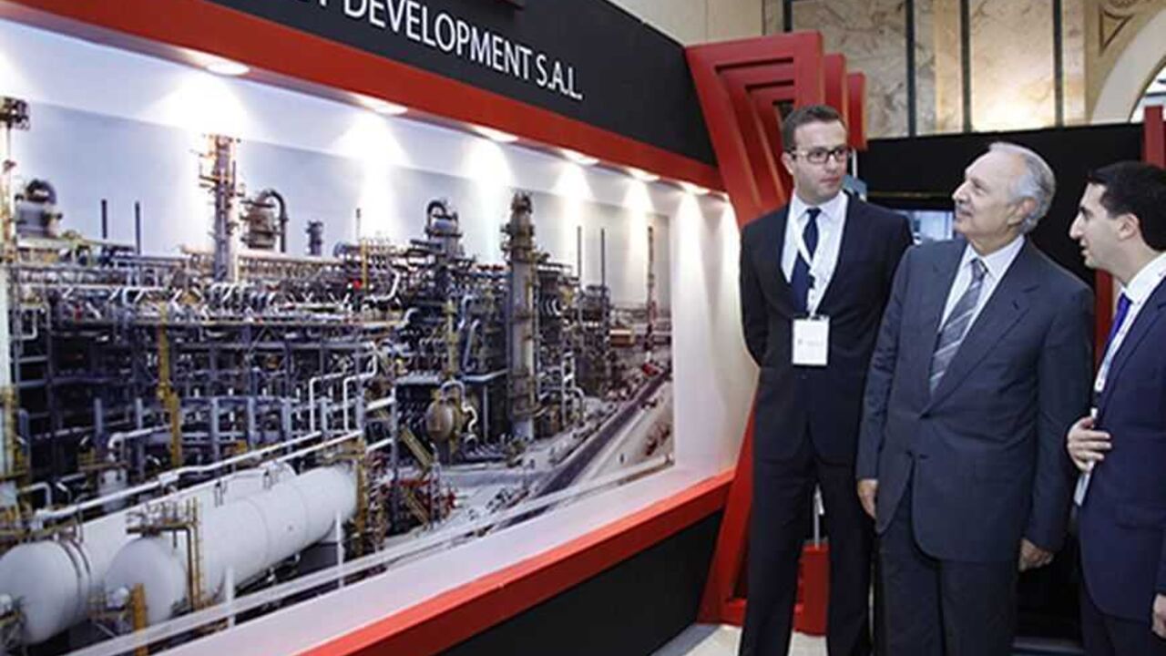 Lebanese Finance Minister Mohammed Safadi (C) tours the stands displayed at an exhibition at the Lebanon International Oil and Gas Summit in Beirut December 3, 2012.    REUTERS/Mohamed Azakir (LEBANON - Tags: ENERGY BUSINESS POLITICS)