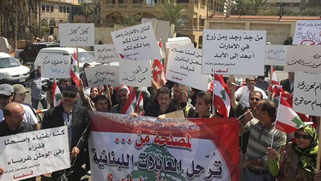 Lebanese Shi'ites, who said they were forced to leave United Arab Emirates last year because of purported security reasons, hold banners during a protest to demand for their rights, in front of the UAE embassy in Beirut May 5, 2010.  REUTERS/Sharif Karim   (LEBANON - Tags: CIVIL UNREST POLITICS SOCIETY EMPLOYMENT BUSINESS)
