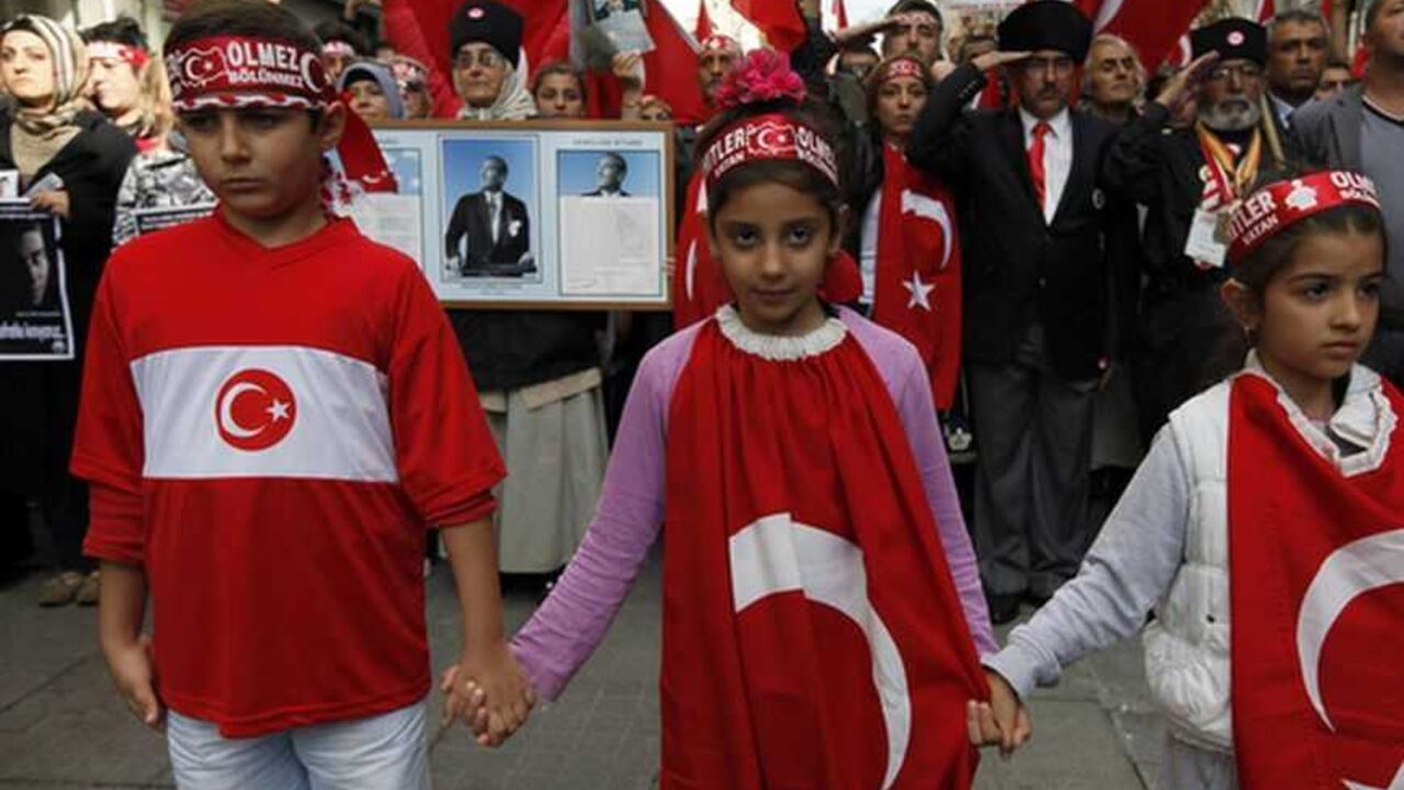 Demonstrators hold a minute of silence during a protest against Kurdistan Workers' Party (PKK) in central Istanbul October 23, 2011. The Turkish military said on Saturday its forces had killed 49 Kurdish militants in the southeast over the last two days, during an offensive to avenge the killing of 24 soldiers by Kurdish fighters earlier this week. REUTERS/Murad Sezer (TURKEYPOLITICS CONFLICT - Tags: POLITICS CIVIL UNREST) CONFLICT)
