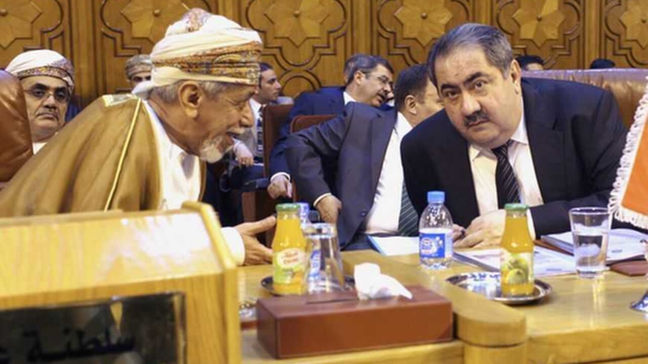 Iraq's Foreign Minister Hoshiyar Zebari (R) talks with an Omani Foreign Affairs representative as they attend the Arab League foreign ministers' meeting on Syria at the Arab League headquarters in Cairo November 12 , 2012.   REUTERS/Asmaa Waguih (EGYPT - Tags: POLITICS) - RTR3ABK8