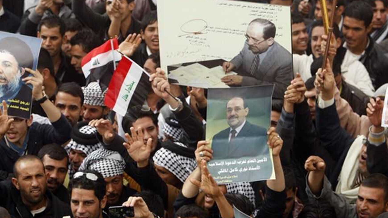 Supporters of Iraqi Prime Minister Nuri al-Maliki shouts slogans during a demonstration in Basra , 420 km (261 miles) southeast of Baghdad January 8, 2013. REUTERS/Atef Hassan  (IRAQ - Tags - Tags: POLITICS CONFLICT)