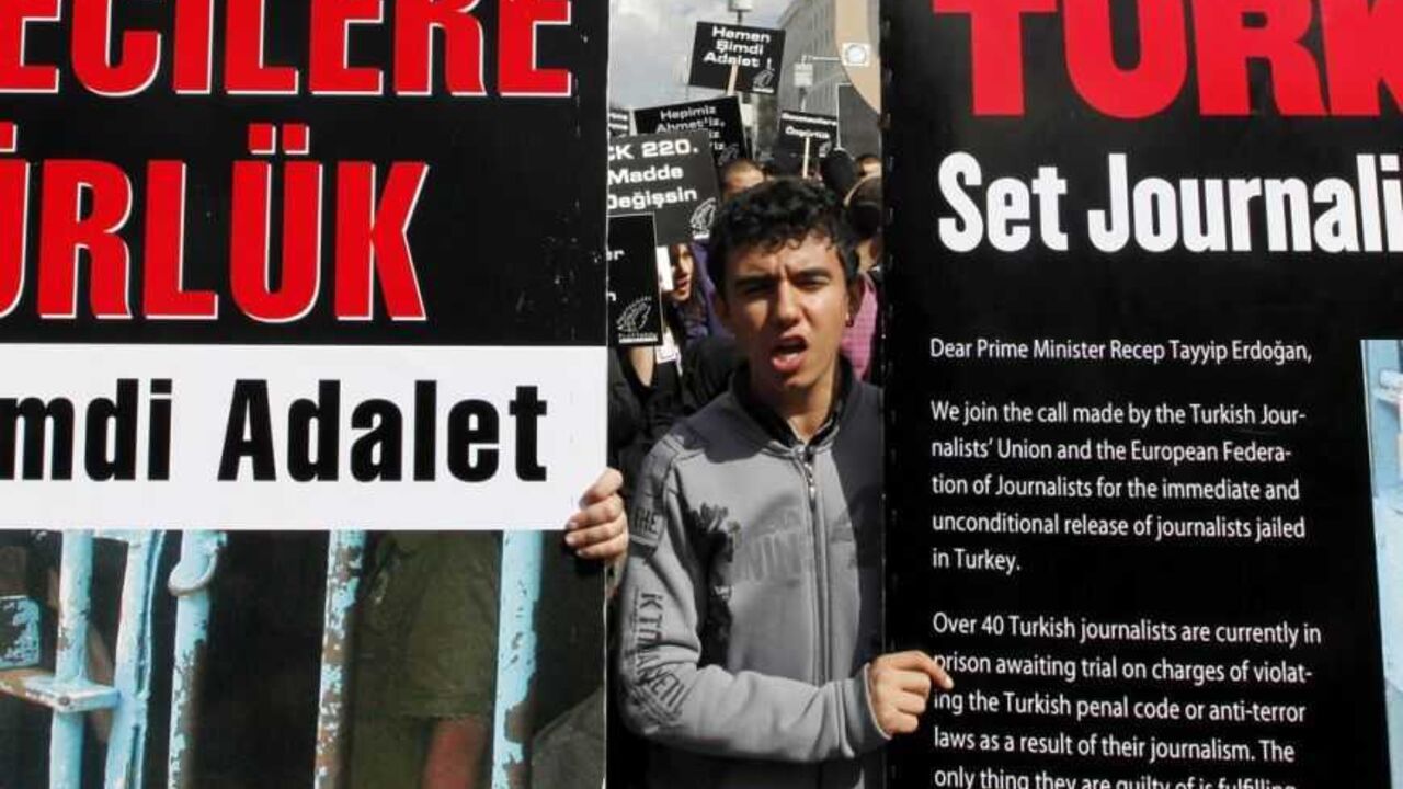 Journalists and activists participate in a rally calling for press freedom in central Ankara March 19, 2011. The recent arrest and jailing of some 10 journalists as part of investigations into Ergenekon, an ultra-nationalist, secularist network opposed to Prime Minister's Tayyip Erdogan's rule, has a triggered expressions of concern from the European Union, the U.S. and human rights groups about Ankara's commitment to media freedom and democratic principles. REUTERS/Umit Bektas (TURKEY - Tags: CIVIL UNREST 