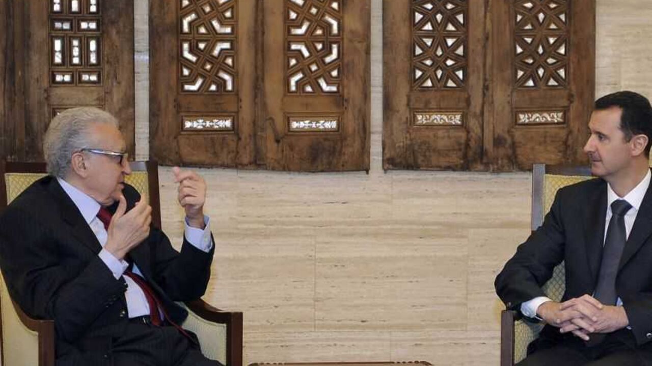 Syria's President Bashar al-Assad (R) meets International peace envoy for Syria Lakhdar Brahimi in Damascus December 24, 2012 in this handout photograph released by Syria's national news agency SANA. Brahimi met with Assad in Damascus on Monday to discuss a solution to the country's 21-month-old conflict. Brahimi told journalists after the meeting that he discussed the situation in Syria overall and gave his views on how to solve the crisis. He said conditions in the country were still poor. REUTERS/Sana (S