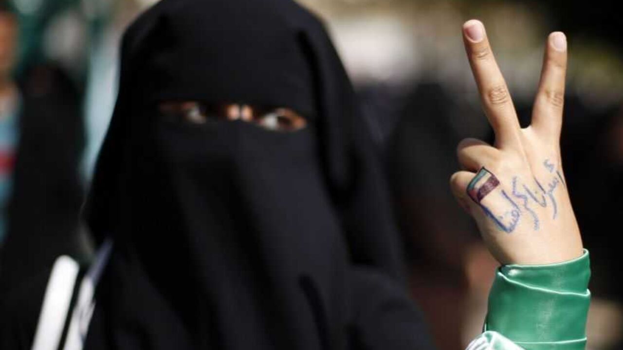 A Palestinian woman raises her hand written with the Arabic words "our prisoners are our dignity" as she takes part in a protest against the death of a Palestinian detainee in an Israeli jail, in Gaza City February 24, 2013. Palestinian officials on Saturday demanded an international investigation into the death of a Palestinian detainee who died in an Israeli jail hours earlier. A spokeswoman for Israel's Prison Authority said that the detainee, 30-year-old Arafat Jaradat, had apparently died of cardiac ar
