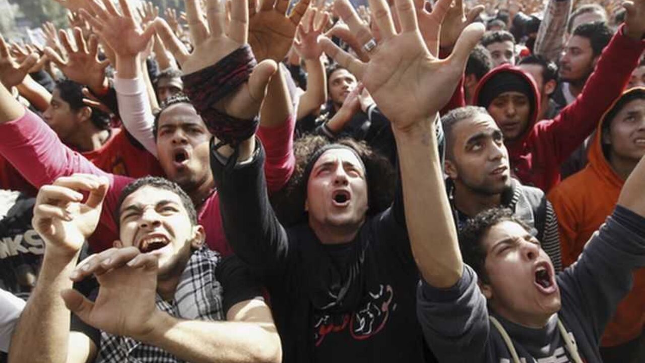 Al Ahly fans, also known as "Ultras", celebrate and shout slogans in front of the Al Ahly club after hearing the final verdict of the 2012 Port Said massacre in Cairo January 26, 2013. An Egyptian court on Saturday sentenced to death 21 people found guilty of involvement in the Port Said soccer stadium disaster in which 74 people died last year. Seventy-three people have been charged with involvement in the February 1, 2012 disaster at the end of a match between Cairo's Al Ahly and al-Masry, the local side.