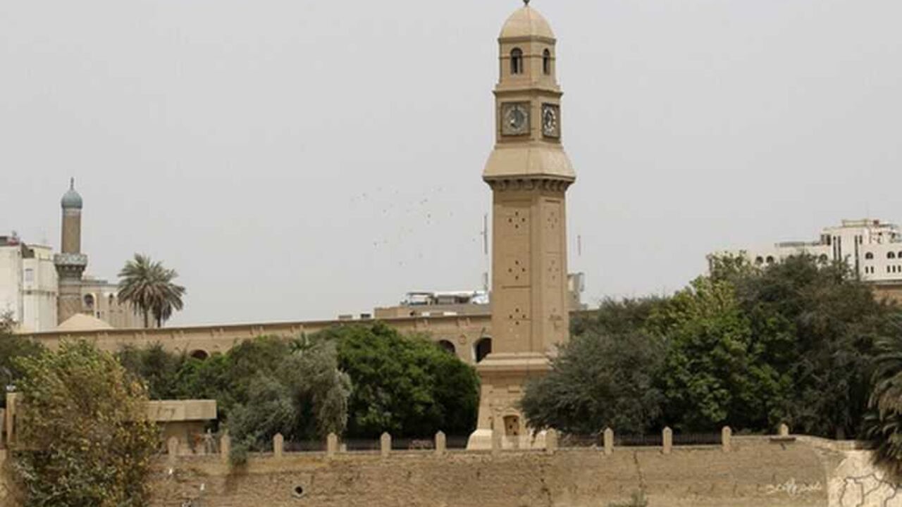 The clock tower of Qushla is seen at noon in central Baghdad April 2, 2012. Qushla, or the Ottoman government headquarters on the bank of the Tigris River in Baghdad's Rusafa side is one of the city's important archaeological sites and tourist attractions. REUTERS/Thaier al-Sudani (IRAQ - Tags: SOCIETY) - RTR308PW