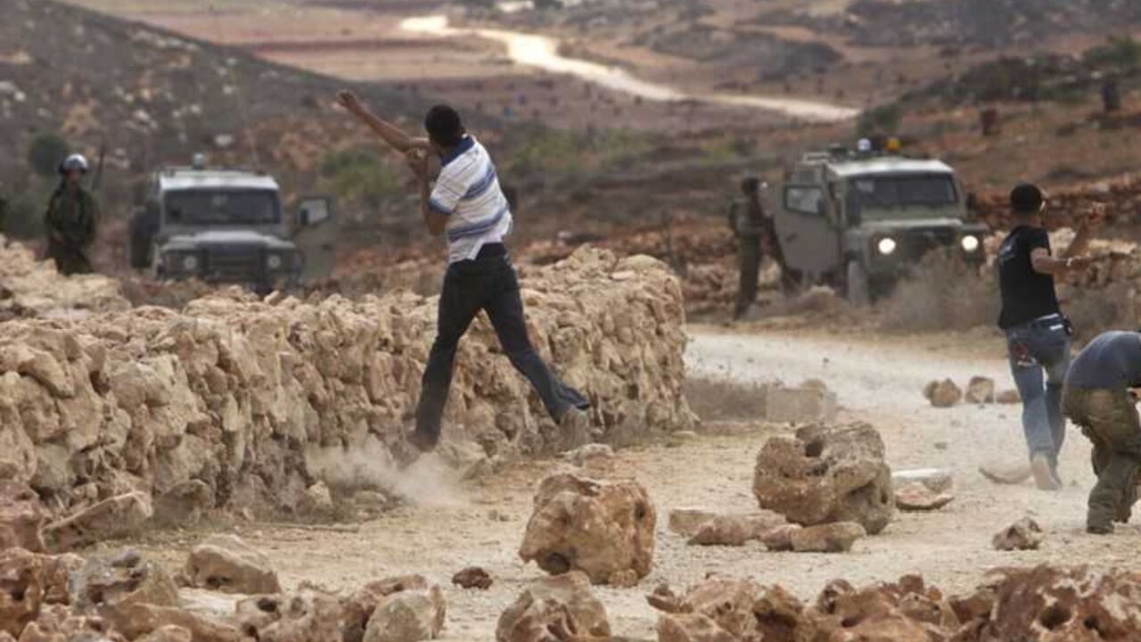 Palestinian protesters throw stones at Israeli soldiers during clashes in the West Bank village of Qusra near Nablus September 23, 2011. Israeli security forces shot dead a Palestinian in the West Bank on Friday during a confrontation in his village with Jewish settlers, Palestinian officials said. Tensions have been growing between Palestinians and settlers who stake a biblical claim to the West Bank, as the Palestinian leadership prepared to seek full U.N. membership for a state partly on the Israeli-occu