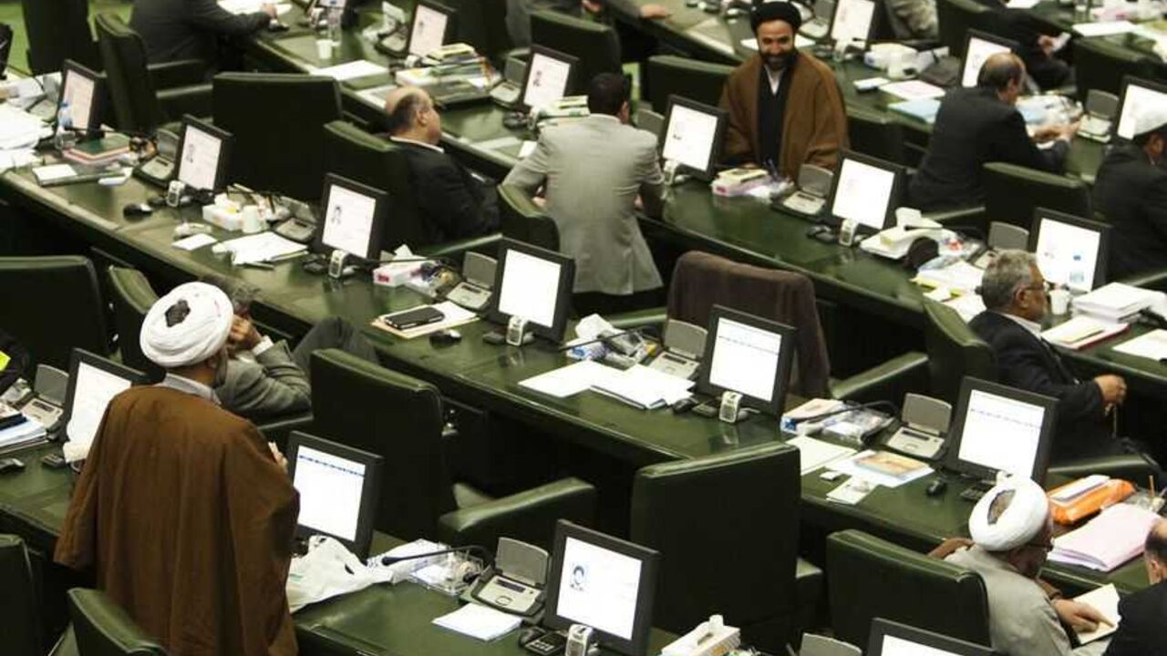 EDITORS' NOTE: Reuters and other foreign media are subject to Iranian restrictions on leaving the office to report, film or take pictures in Tehran.

A general view of a parliament session in Tehran November 1, 2011. Iran's parliament is threatening to impeach two of Mahmoud Ahmadinejad's ministers, in a new wave of pressure against the president who is under attack from lawmakers. REUTERS/Raheb Homavandi (IRAN - Tags: POLITICS BUSINESS CRIME LAW) - RTR2THAP