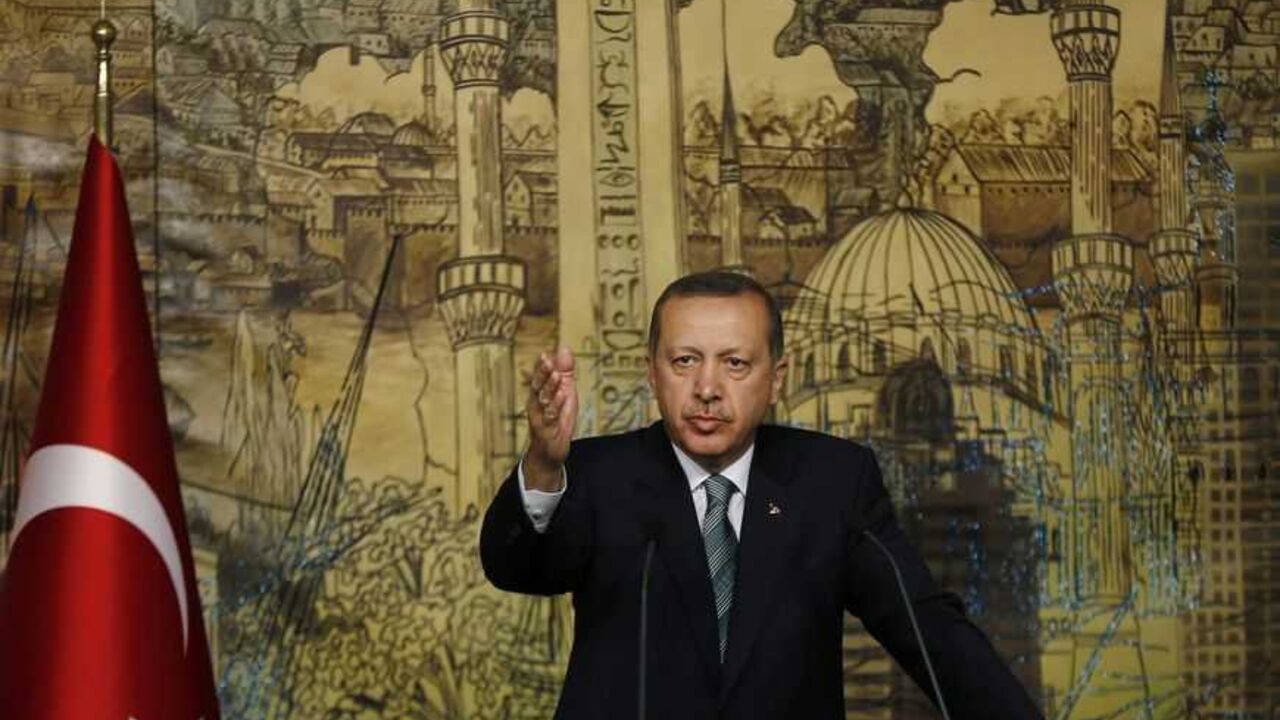 Turkey's Prime Minister Tayyip Erdogan reacts during a joint news conference with his Greek counterpart Antonis Samaras (not pictured) in Istanbul March 4, 2013. REUTERS/Murad Sezer (TURKEY - Tags: POLITICS) - RTR3EKA8