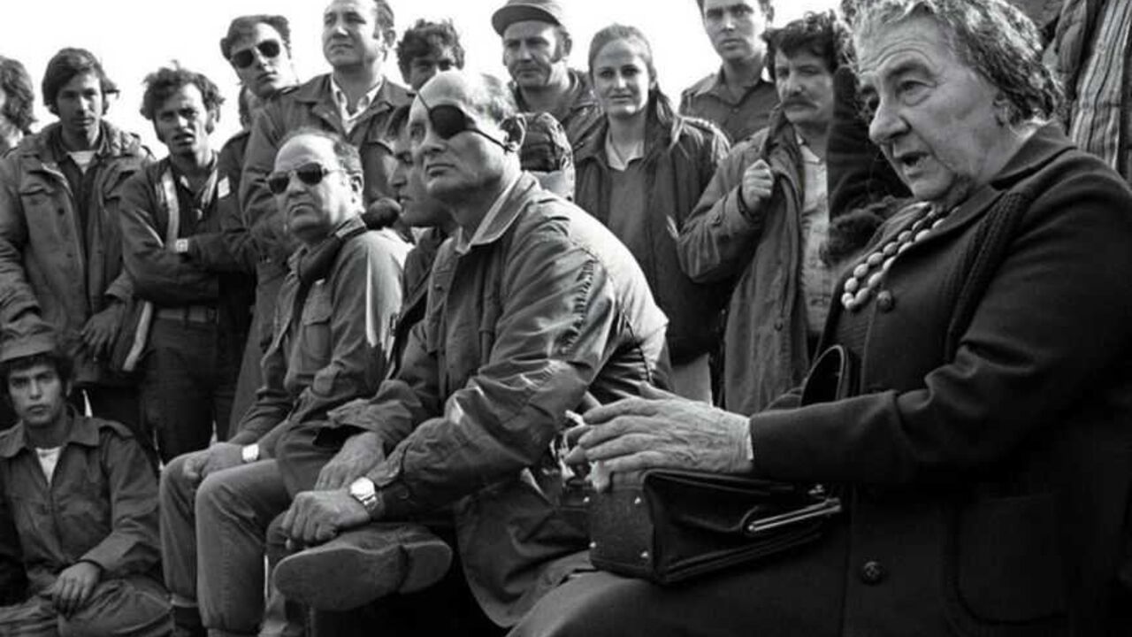 - FILE PHOTO 21NOV73 - Prime Minister Golda Meir (R) accompanied by her Defense Minister Moshe Dayan, meets with Israeli soldiers at a base on the Golan Heights after intense fighting during the 1973 Yom Kippur War.[ Israel was simultaneously attacked by Syria and Egypt on Yom Kippur, the Jewish Day of Atonement when all of Israel comes to a standstill, and was only able to defeat both countries when the United States provided an emergency major resupply of equipment. Israel suffered heavy causalities and m