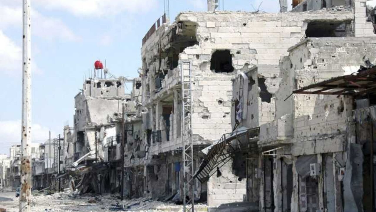 A view is seen of damaged buildings at Baba Amro neighborhood in Homs city, after clashes between forces loyal to Syrian President Bashar al-Assad and fighters of the Free Syrian Army, is seen in this handout photograph distributed by Syria's national news agency SANA March 27, 2013. REUTERS/SANA/Handout (SYRIA - Tags: CONFLICT CIVIL UNREST RELIGION) ATTENTION EDITORS - THIS IMAGE WAS PROVIDED BY A THIRD PARTY. THIS PICTURE IS DISTRIBUTED EXACTLY AS RECEIVED BY REUTERS, AS A SERVICE TO CLIENTS. FOR EDITORIA