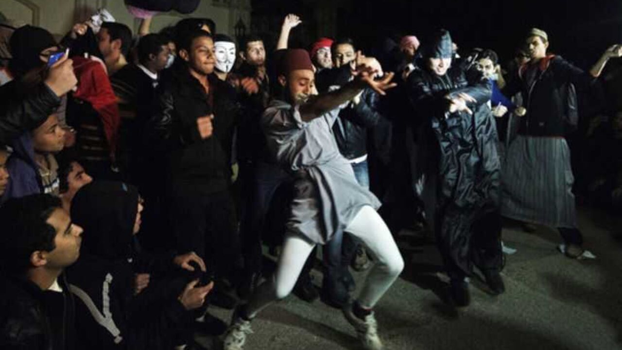 Egyptian Actvists and youth perform the Internet craze, the "Harlem Shake" in front of the Muslim Brotherhood headquarters in Cairo on February 28, 2013. AFP PHOTO/GIANLUIGI GUERCIA        (Photo credit should read GIANLUIGI GUERCIA/AFP/Getty Images)