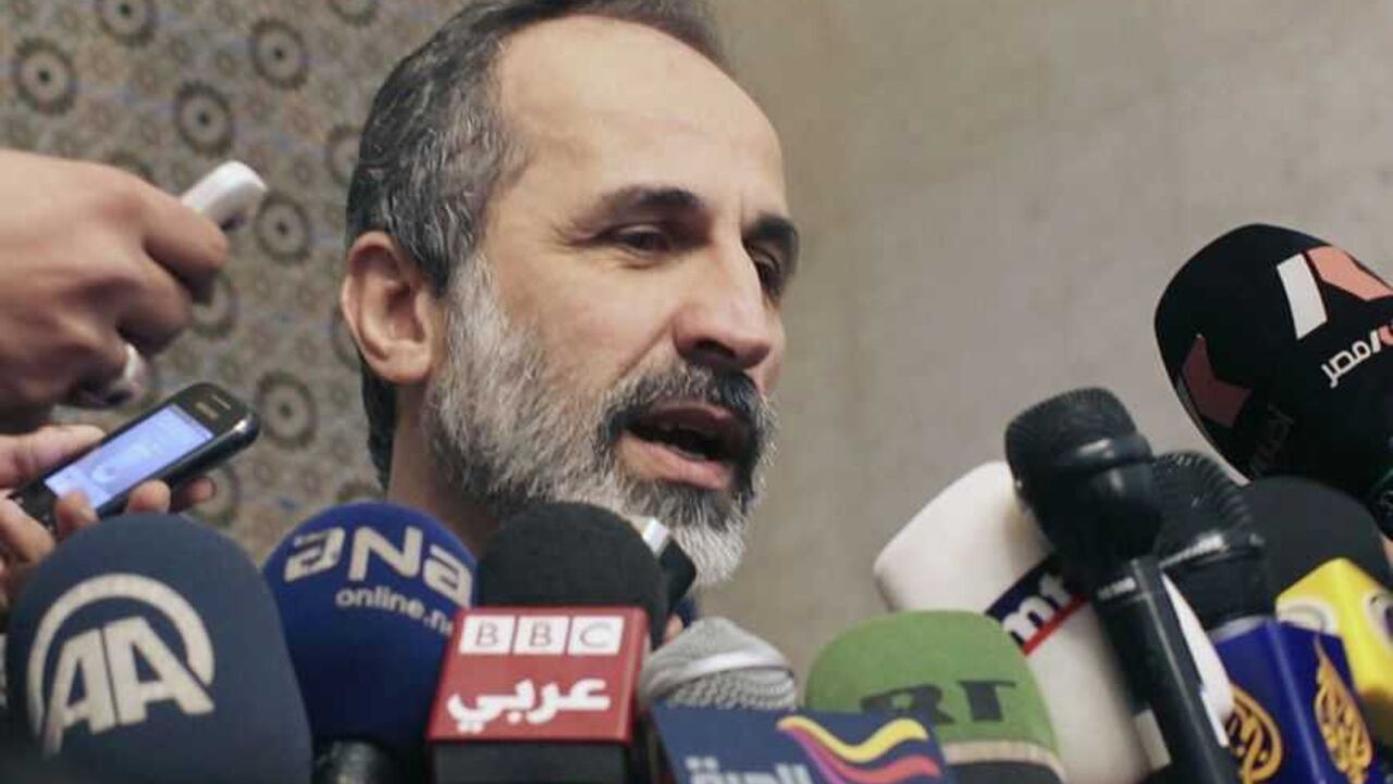 Syrian National Coalition leader Moaz Alkhatib speaks to the media after meeting with Arab League head Nabil al-Arabi in Cairo February 11, 2013. REUTERS/Asmaa Waguih (EGYPT - Tags: POLITICS) - RTR3DMQ7