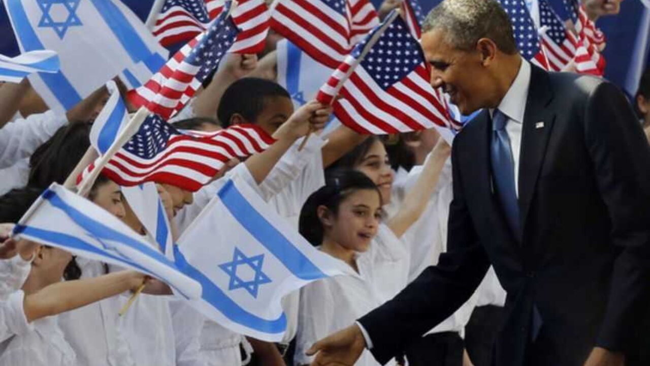 U.S. President Barack Obama shakes hands with children before he signs a guest book at the residence of Israel's President Shimon Peres in Jerusalem, March 20, 2013. Making his first official visit to Israel, U.S. President Barack Obama pledged on Wednesday unwavering commitment to the security of the Jewish State where concern over a nuclear-armed Iran has clouded U.S.-Israeli relations. REUTERS/Larry Downing  (JERUSALEM - Tags: POLITICS) - RTR3F8AE