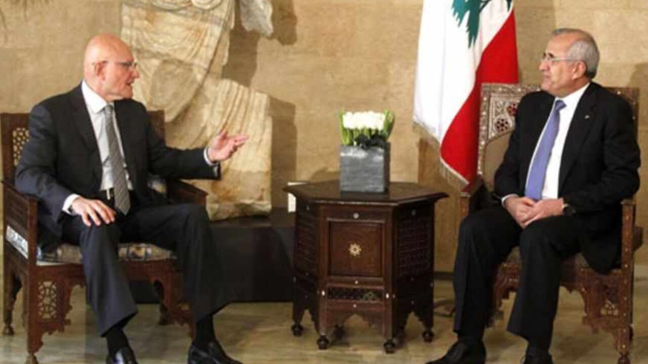 Newly elected Lebanese Prime Minister Tammam Salam (L) talks with Lebanon's President Michel Suleiman at the presidential palace in Baabda, near Beirut April 6, 2013. Lebanon's president formally asked Sunni Muslim politician Tammam Salam to form a new government on Saturday after Salam won overwhelming support from parliamentarians to be the country's new prime minister. REUTERS/Sharif Karim (LEBANON - Tags: POLITICS) - RTXYAK0