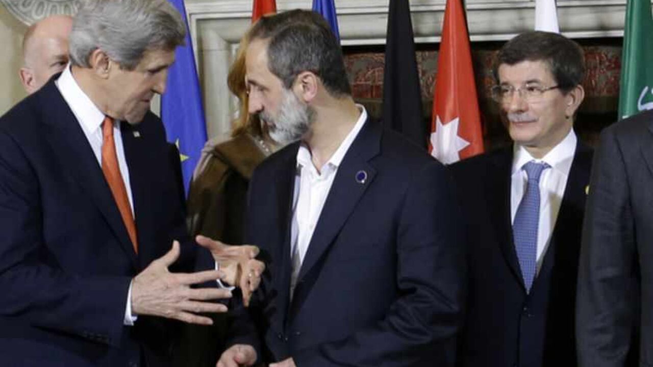 U.S. Secretary of State John Kerry (L) speaks with Syrian National Coalition President Mouaz al-Khatib, next to Turkish Foreign Minister Ahmet Davutoglu, and Qatar's Prime Minister and Foreign Minister Sheikh Hamad bin Khalifa al-Thani, during meetings at Villa Madama in Rome February 28, 2013. REUTERS/Jacquelyn Martin/Pool (ITALY - Tags: POLITICS) - RTR3EDX6