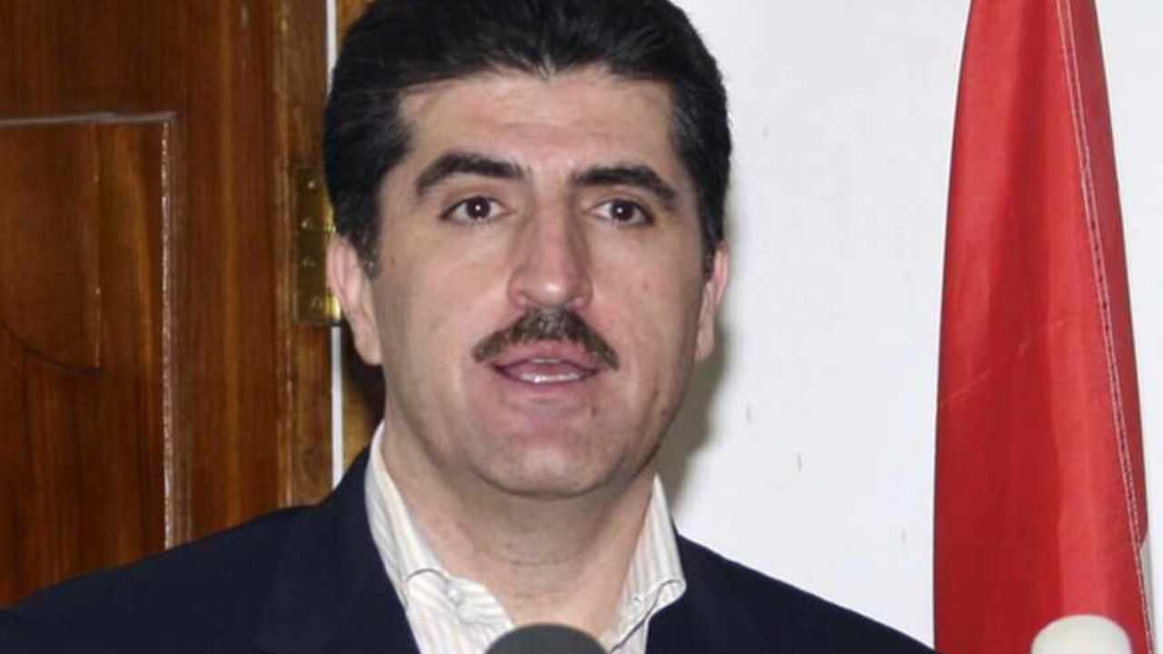 Iraq's Kurdistan Prime Minister Nechirvan Barzani (L) and Ali Babeer, the leader of the Kurdish Islamic Group, hold a news conference in Arbil, 310 km (193 miles) north of Baghdad July 27, 2009. REUTERS/Azad Lashkari (IRAQ CONFLICT) - RTR264CT