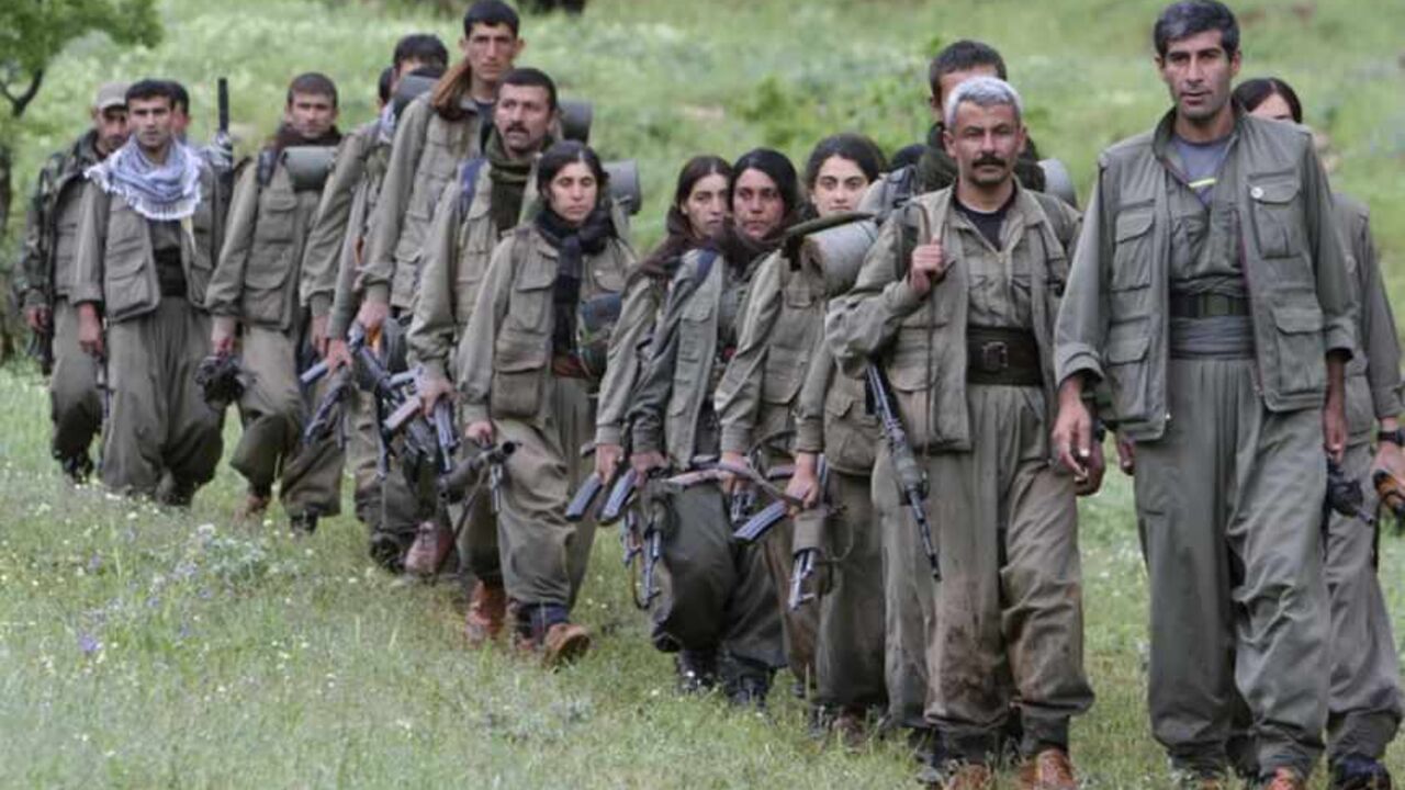 Kurdistan Workers Party (PKK) fighters walk on the way to their new base in northern Iraq May 14, 2013. The first group of Kurdish militants to withdraw from Turkey under a peace process entered northern Iraq on Tuesday, and were greeted by comrades from the Kurdistan Workers Party (PKK), in a symbolic step towards ending a three-decades-old insurgency. The 13 men and women, carrying guns and with rucksacks on their backs, arrived in the area of Heror, near Metina mountain on the Turkish-Iraqi border, a Reu