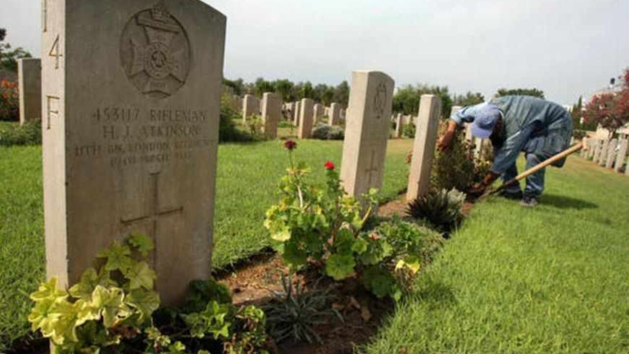 TO GO WITH AFP STORY BY JOE KRAUSS
Ibrahim Jeradeh, a worker for the Commonwealth War Graves Commission (CWGC), maintains a cemetery north of Gaza City, 17 October 2007. The close-cut grass, the blossoming trees, and the row after row of austere white chiseled tombstones evoke the famed war cemeteries of northern France rather than the chaos of the Gaza Strip. AFP PHOTO/MOHAMMED ABED (Photo credit should read MOHAMMED ABED/AFP/Getty Images)