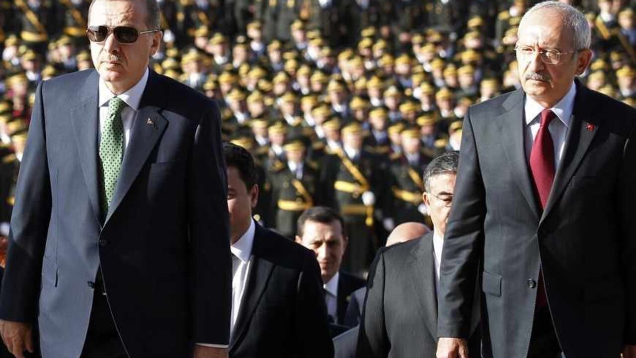 Turkey's Prime Minister Tayyip Erdogan (2nd R) and leader of the main opposition Republican People's Party (CHP) Kemal Kilicdaroglu (R) attend an official ceremony to mark the 89th anniversary of Republic Day at Anitkabir in Ankara October 29, 2012. Anitkabir is the mausoleum of Mustafa Kemal Ataturk, founder of secular Turkey. REUTERS/Umit Bektas (TURKEY - Tags: POLITICS) - RTR39QHB