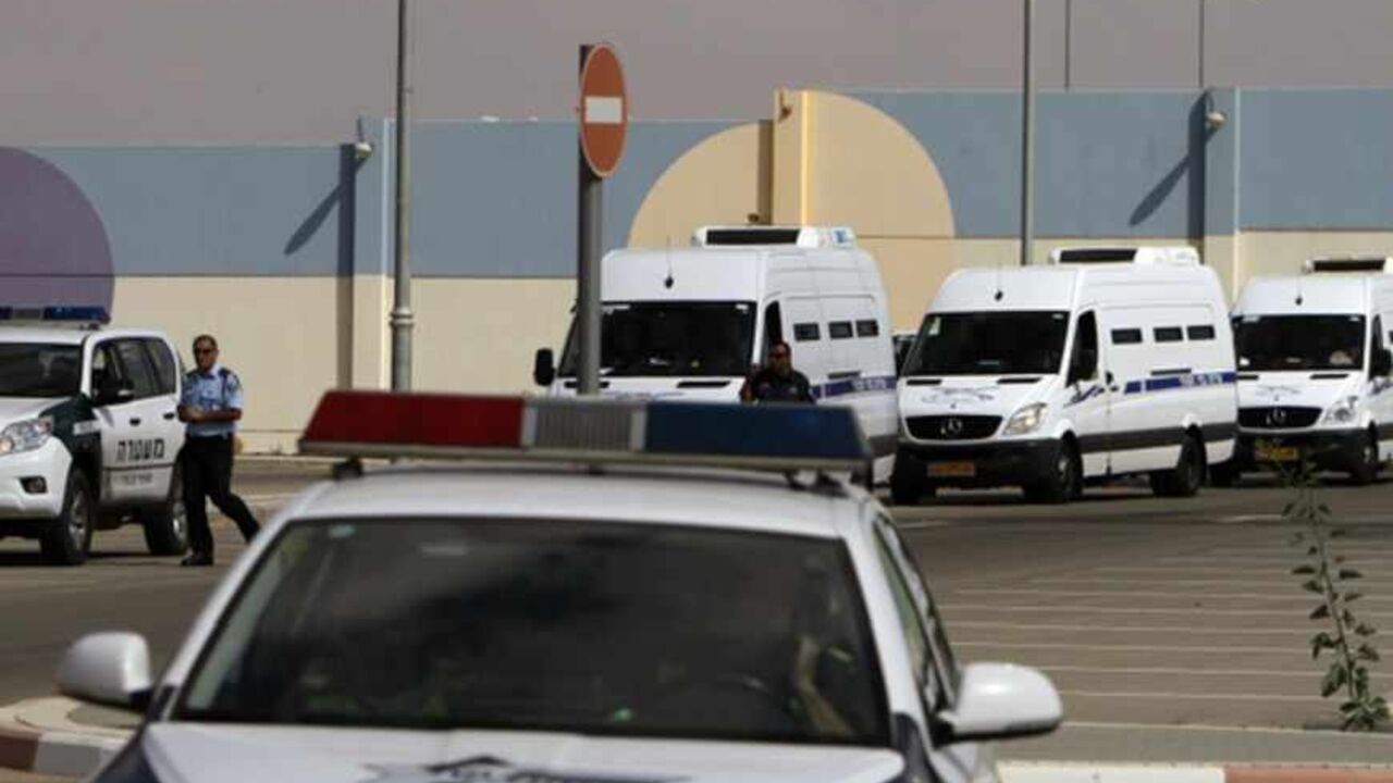A convoy of Israeli Prison Authority vehicles leaves Ela prison in the southern city of Beersheba, as they transport Egyptian prisoners due to be released through the border crossing next to the Egyptian Red Sea resort of Taba, October 27, 2011. Egyptians gathered at the border with Israel on Thursday awaiting the handover of prisoners to be exchanged for an American-Israeli man held by Egypt and accused of spying. REUTERS/Amir Cohen (ISRAEL - Tags: POLITICS CRIME LAW) - RTR2T9EU