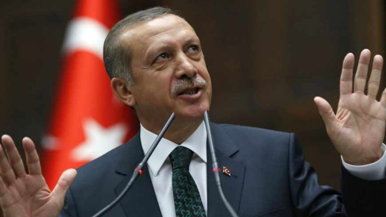 Turkey's Prime Minister Tayyip Erdogan addresses members of parliament from his ruling AK Party (AKP) during a meeting at the Turkish parliament in Ankara June 25, 2013. Turkish anti-terrorism police detained 20 people in raids in the capital Ankara on Tuesday in connection with weeks of anti-government protests across the country, media reports said. The unrest began at the end of May when police used force against campaigners opposed to plans to redevelop a central Istanbul park. The protest spiralled int