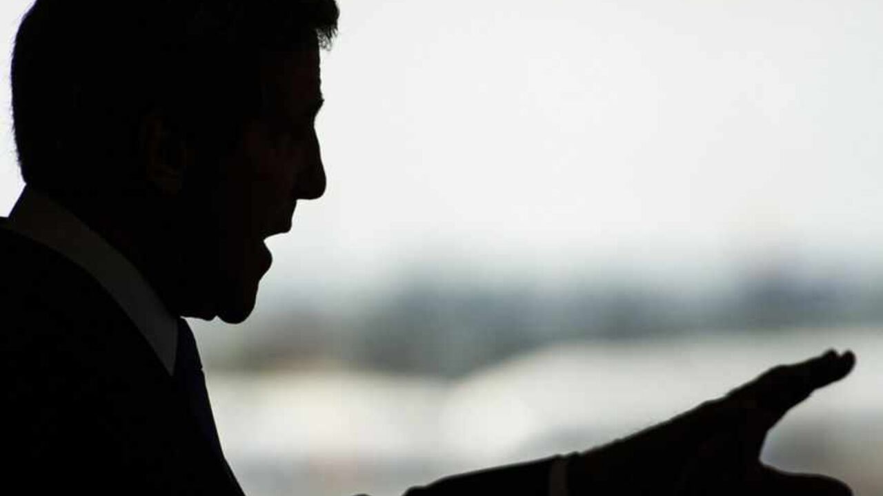 U.S. Secretary of State John Kerry is silhouetted during a news conference at Ben Gurion International Airport near Tel Aviv April 9, 2013. Kerry said on Tuesday he had agreed to work with Israeli and Palestinian leaders to boost economic growth in the occupied West Bank as he seeks ways to revive Middle East peace talks. REUTERS/Paul J. Richards/Pool (JERUSALEM - Tags: POLITICS) - RTXYER1