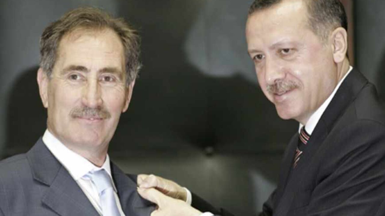 Turkey's Prime Minister Tayyip Erdogan (R) pins his party badge to Ertugrul Gunay's jacket during their ruling Ak Party meeting at the Turkish Parliament in Ankara May 29, 2007. Gunay, one of Turkey's most well-known social democrat politician, joined Ak Party on Tuesday. REUTERS/Umit Bektas (TURKEY) - RTR1Q7Y2